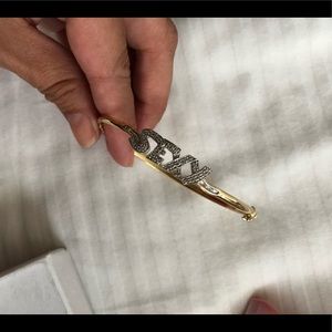 Gorgeous bracelet! It’s 14k gold with some bling!